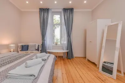 a bedroom with two beds and a window at Spacious vintage 2BR, 2bath apartment by Flat Mаnager in Sofia