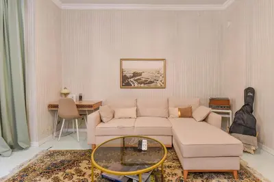 a living room with a couch and a table at Spacious vintage 2BR, 2bath apartment by Flat Mаnager in Sofia