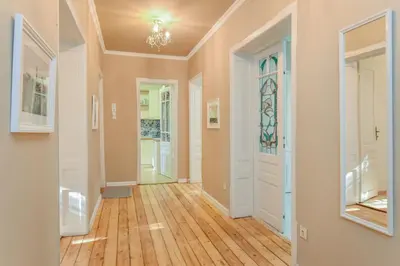 an empty hallway with a door and a stained glass window at Spacious vintage 2BR, 2bath apartment by Flat Mаnager in Sofia