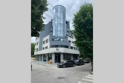 a building with a car parked in front of it at LUX 1BD/1BA City Center Apartment in Blagoevgrad