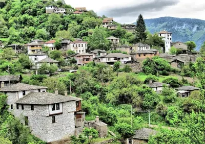 a village on a hill with houses and trees at GUEST HOUSE ELENA in Kosovo