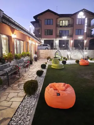 a yard with some inflatable objects on the grass at Perla in Dospat