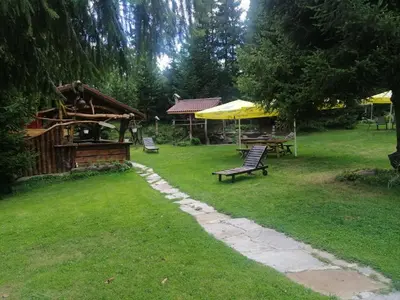 a park with a bench and a table and a pavilion at 