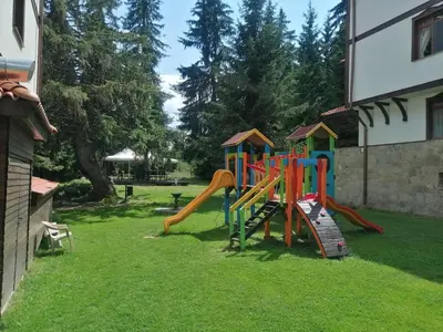 a playground in the yard of a house at 