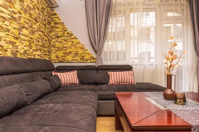 a living room with a couch and a table at 1BD Apartment - 5 mins to the city centre by Flat Mаnager in Plovdiv