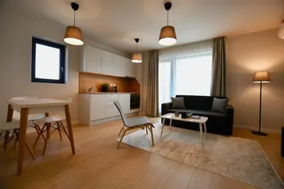 a living room with a couch and a table at Connect Living Apartments in Sofia