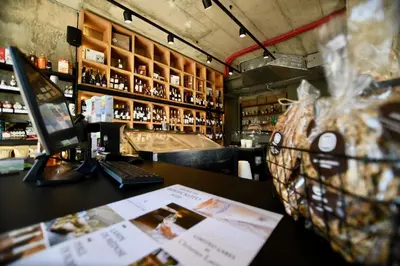 a bar with a counter in a room with alcohol at Connect Living Apartments in Sofia