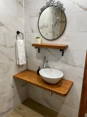 a bathroom with a sink and a mirror at Вила Пенчеви, кк. Цигов чарк in Tsigov Chark