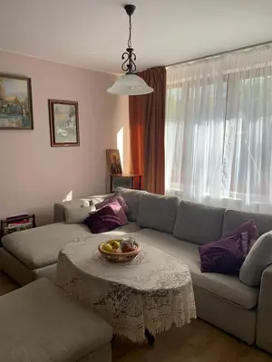 a living room with a couch and a table at Guest House Kalina in Sapareva Banya
