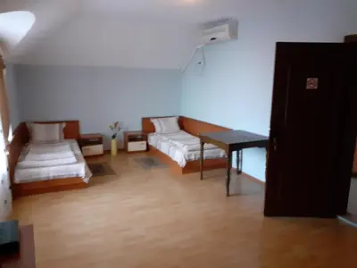 a living room with a couch and a table at Хотелски Комплекс Авалон in Asenovgrad