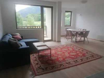 a living room with a couch and a table at Комплекс Падалото 