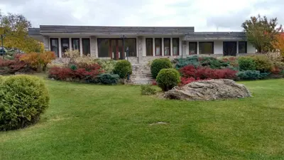 a house with a lawn in front of it at Комплекс Падалото 