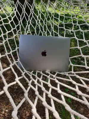 a laptop computer sitting on top of a net at Guest House Ela in Dolna Banya