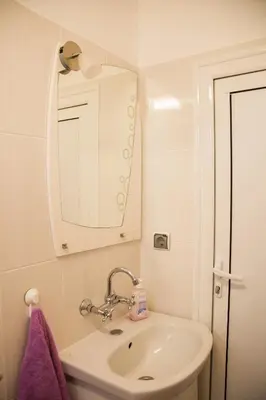 a bathroom with a sink and a mirror at вила Топи in Kaloyanovo