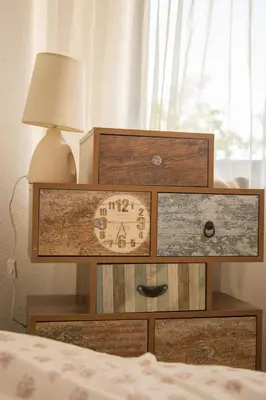 a dresser with a clock on it next to a bed at вила Топи in Kaloyanovo