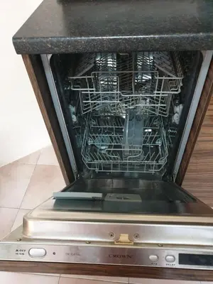 a dishwasher with a rack of dishes in it at Apartment Lozenets in Sofia