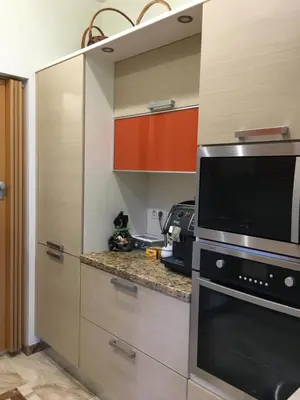 a kitchen with a microwave oven and a stove at Luxury Villa Borina in Zheleznitsa