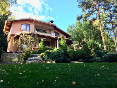 a house with a lawn in front of it at Luxury Villa Borina in Zheleznitsa