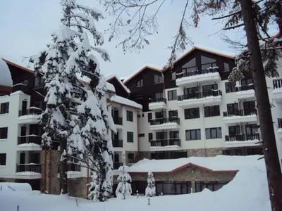 a large apartment building with snow on it at VALENTINA`S STUDIO in 