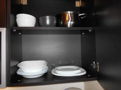 a shelf with bowls and plates in a kitchen at VALENTINA`S STUDIO in 