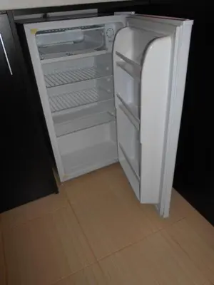 an empty refrigerator with its door open in a kitchen at VALENTINA`S STUDIO in 