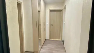 a hallway with a mirror and a hallway with a door at Paradise Swing Apartment Sofia in Sofia