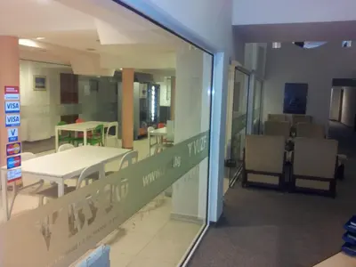 a view of a room with tables and chairs at Hostel Elena in Sofia