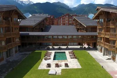 an aerial view of a building with a courtyard at Private Studio Pirin Golf Hotel Bansko in Razlog