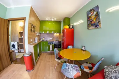 a room with a table and a kitchen with green at Gondola 1 BDRM Flat in Cedar Lodge IV (D2) in Bansko