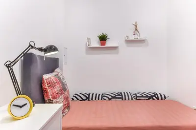 a room with a desk with a lamp and a chair at Cosy & renovated 2BD flat near Vitoshka by Flat Mаnager in Sofia