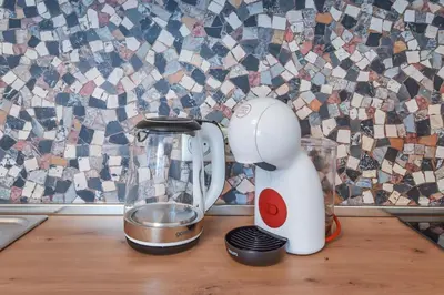 a white blender sitting on a counter next to a mixer at Cosy & renovated 2BD flat near Vitoshka by Flat Mаnager in Sofia