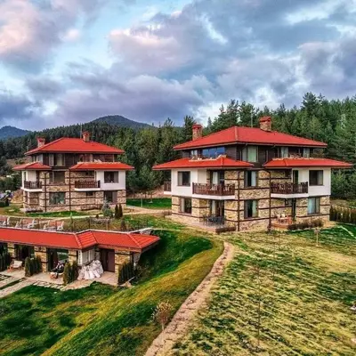 an aerial view of a house with red roofs at Къщи за гости 