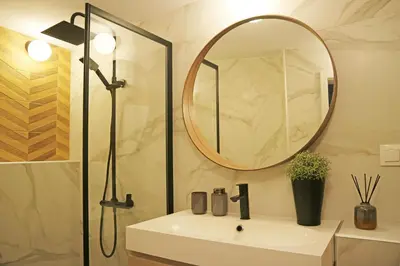 a bathroom with a sink and a mirror at Modern Cozy Apartment in Kyustendil