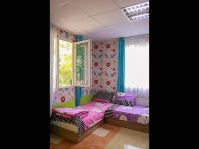 a bedroom with two beds and a window at Nice bungalow in Petrich in Kamena