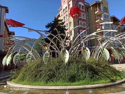 a garden in the middle of a city at Mountain view Private apartments in Pirin Golf and SPA resort in Razlog
