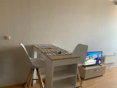 a desk with two chairs and a computer on it at Aspen heights studio 308 in Razlog