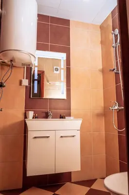 a bathroom with a sink and a mirror at Луксозен апартамент - 