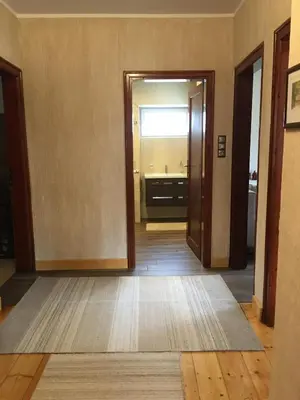 an empty hallway with a door open to a bathroom at Willy Villy`s house in Chepelare