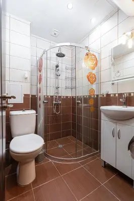 a bathroom with a shower and a toilet and a sink at 1BD apartment in a calm area near the centre by Flat Mаnager in Plovdiv