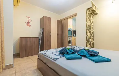 a bedroom with a bed with blue towels on it at 1BD apartment in a calm area near the centre by Flat Mаnager in Plovdiv