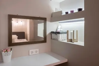 a bathroom with a mirror and a white counter at Central & Beautiful Apartment - Perfect Location by Flat Mаnager in Sofia