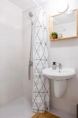 a white bathroom with a sink and a shower at Central & Beautiful Apartment - Perfect Location by Flat Mаnager in Sofia