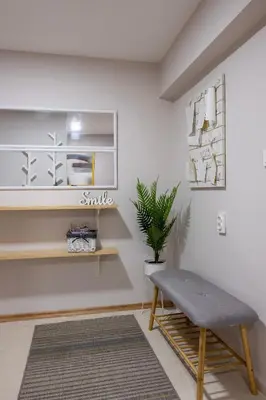a living room with a bench and a plant at Central & Beautiful Apartment - Perfect Location by Flat Mаnager in Sofia