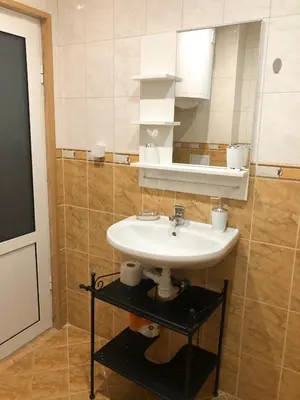 a bathroom with a sink and a mirror at Temerso Studio-Apartment in Bansko