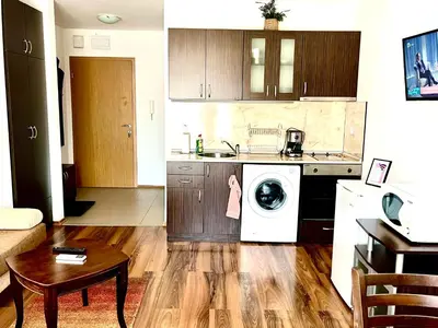 a kitchen with a washing machine in a kitchen at Nickmar Studio-Apartment in Bansko