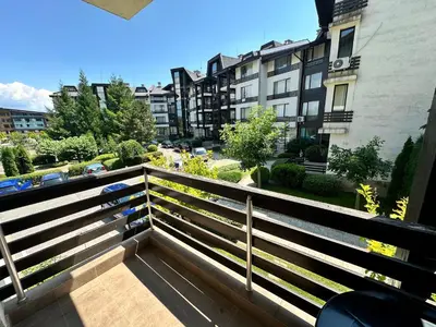 a balcony with a view of a building at Aspen Golf - private apartments in Razlog