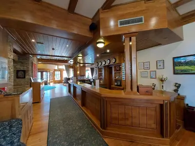 a large kitchen with wooden floors and wooden walls at Airy Studio Pirin Golf Aparthotel SPA H2A92 in Razlog
