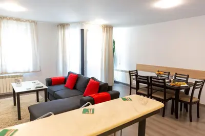 a living room with a couch and a table at Fancy Big apartment in the heart of Sofia in Sofia