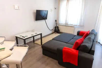 a living room with a couch and a table at Fancy Big apartment in the heart of Sofia in Sofia