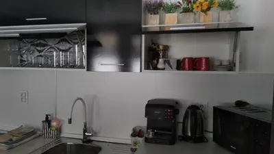 a kitchen with a sink and a coffee maker at Snow Dreams 1 Grand Monastery in Pamporovo